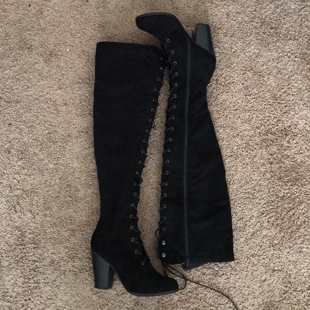 Thigh High Black Lace Up Boots.
